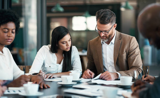 Leadership, mentor and training with business people in  strategy meeting, project management or coaching. Corporate manager, ceo or leader with planning, collaboration or working on innovation idea.
