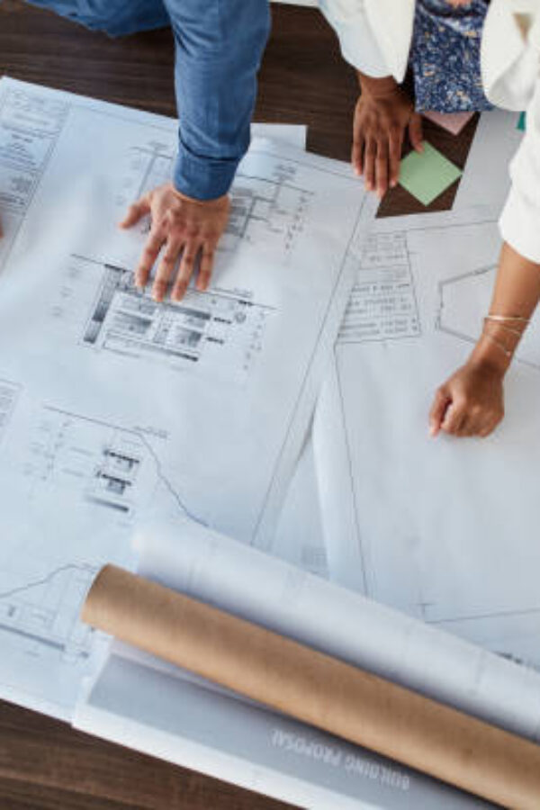 Architecture planning, development and project management business people hands with floor plan paper or charts for analysis. Teamwork, collaboration and design workers with strategy, mission or goal